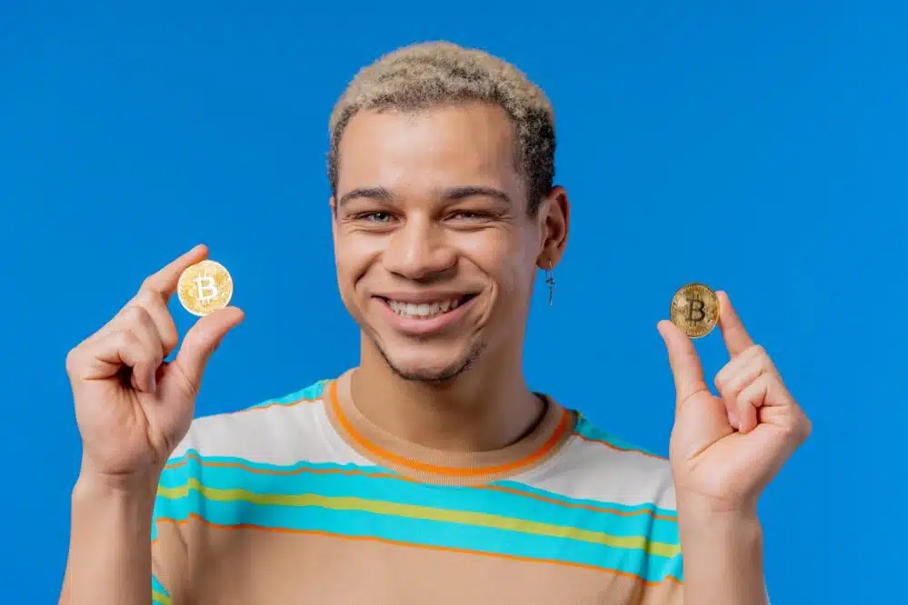 man with bitcoins crypto currency golden coin on 2025 03 08 21 16 12 utc