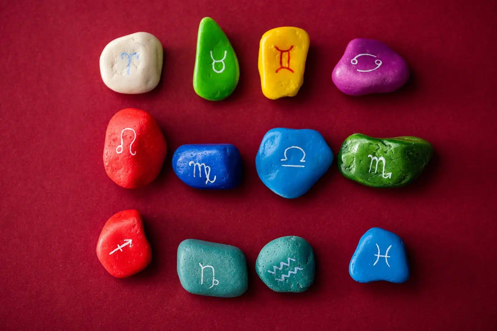 top-view-of-colorful-stones-with-zodiac-signs-on.jpg